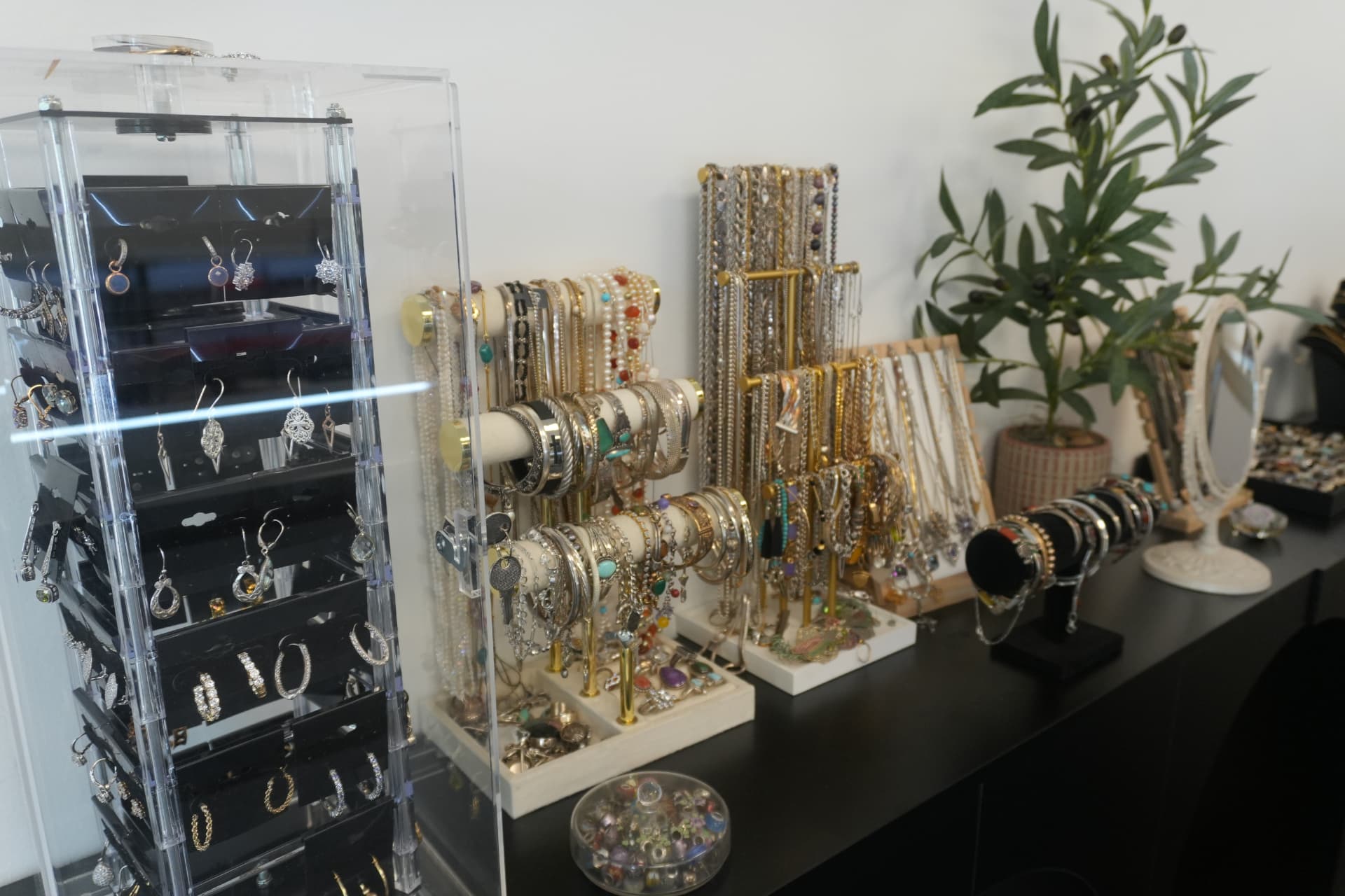 Inside Whitehall Coin and Jewelry, display cases of gold jewelry and collectible coins